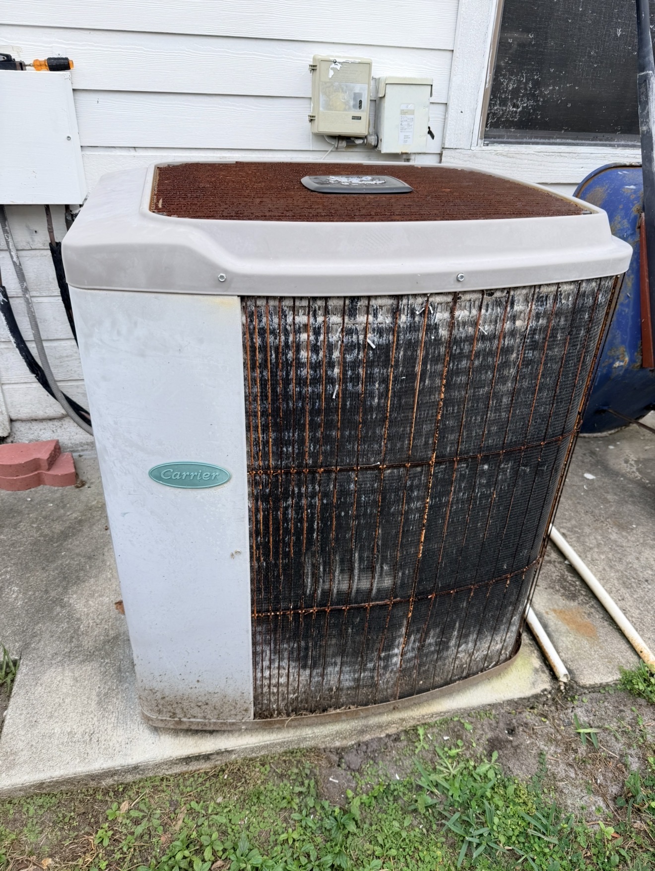 Dirty Carrier condenser coil caked with debris and salt-air buildup