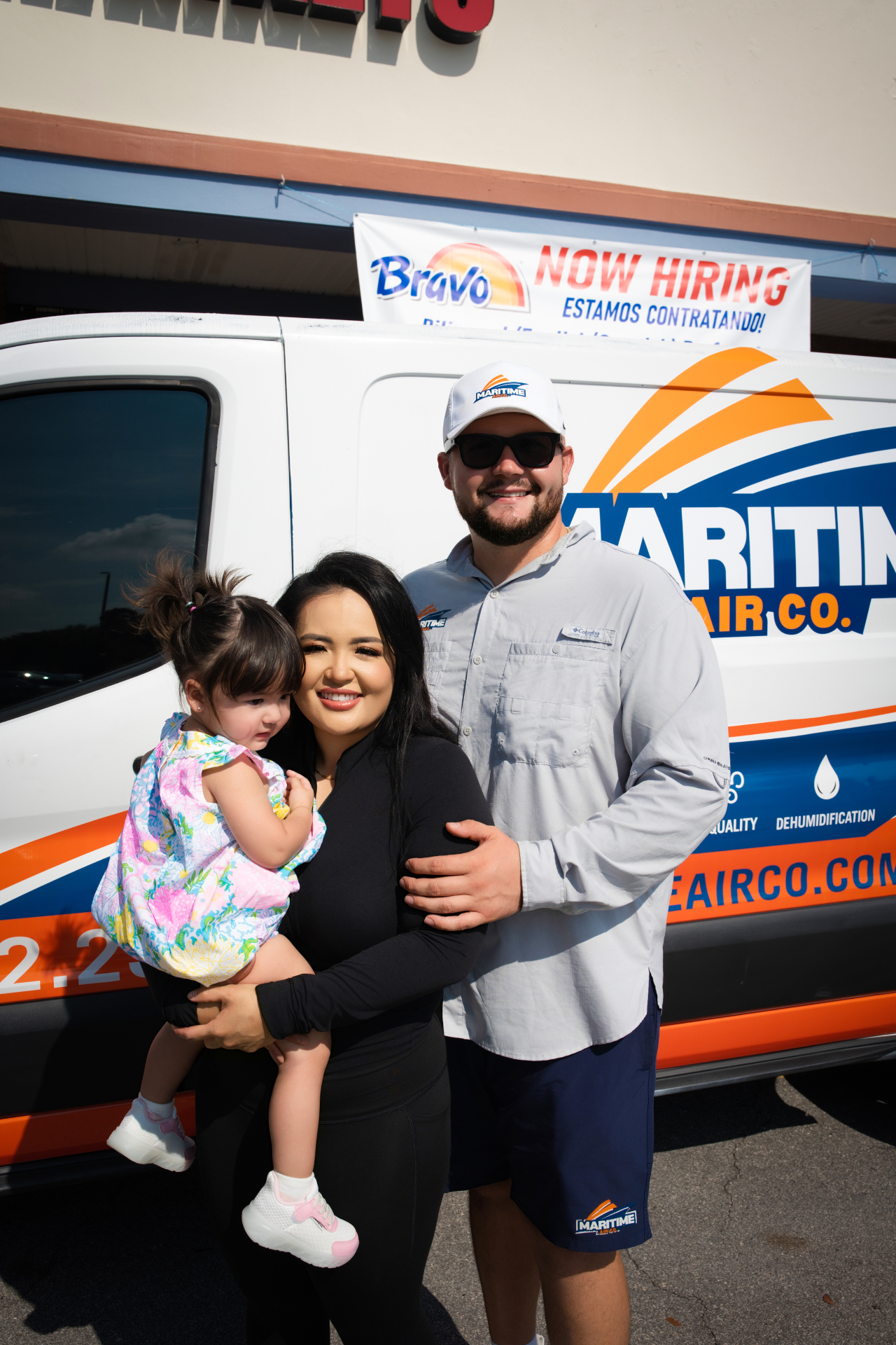 Devon Schoby, My, and baby Everly in front of a Maritime Air Co. service van — family-owned HVAC on the Treasure Coast