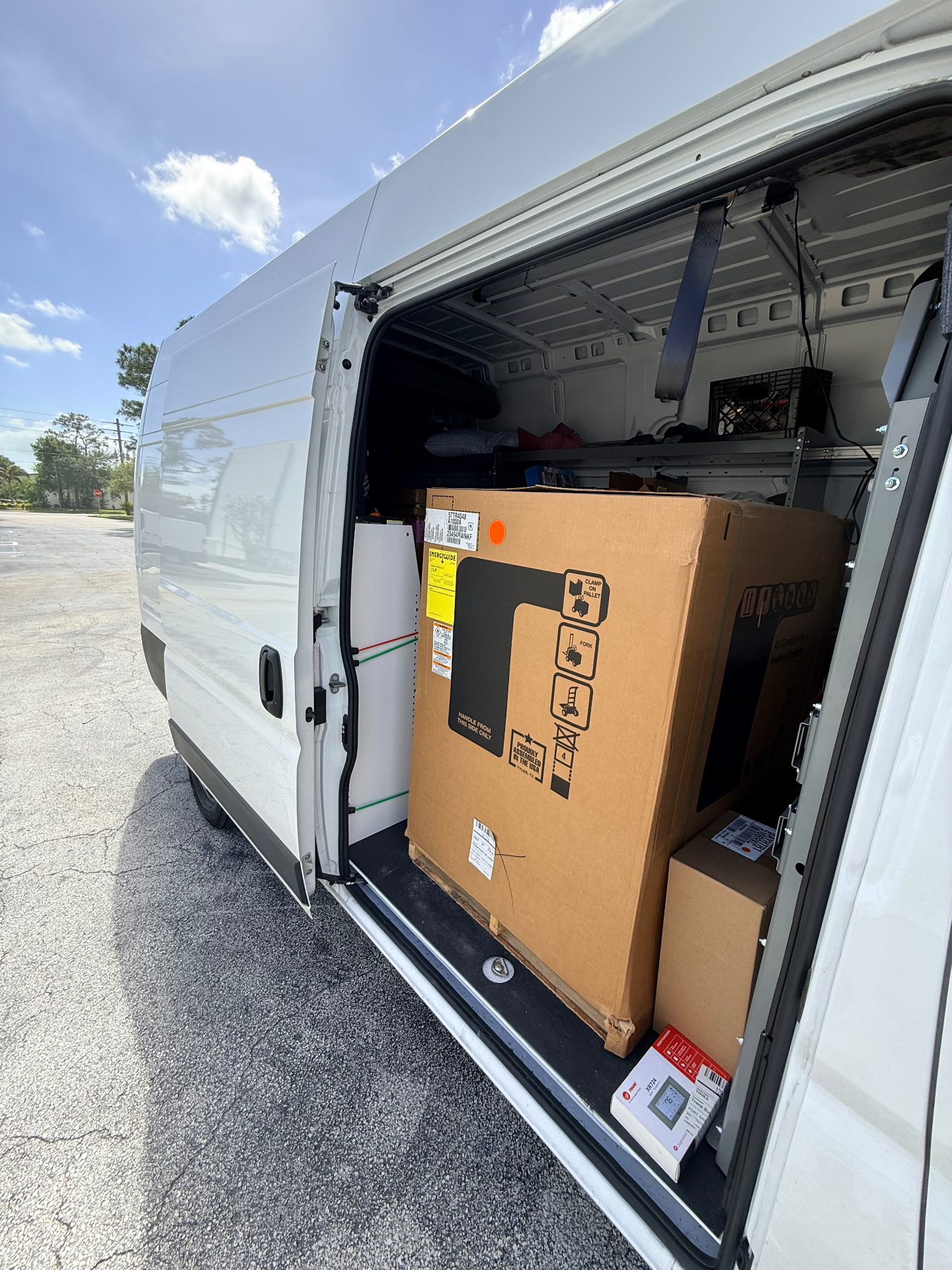 Maritime Air Co. service van loaded with new Trane HVAC equipment