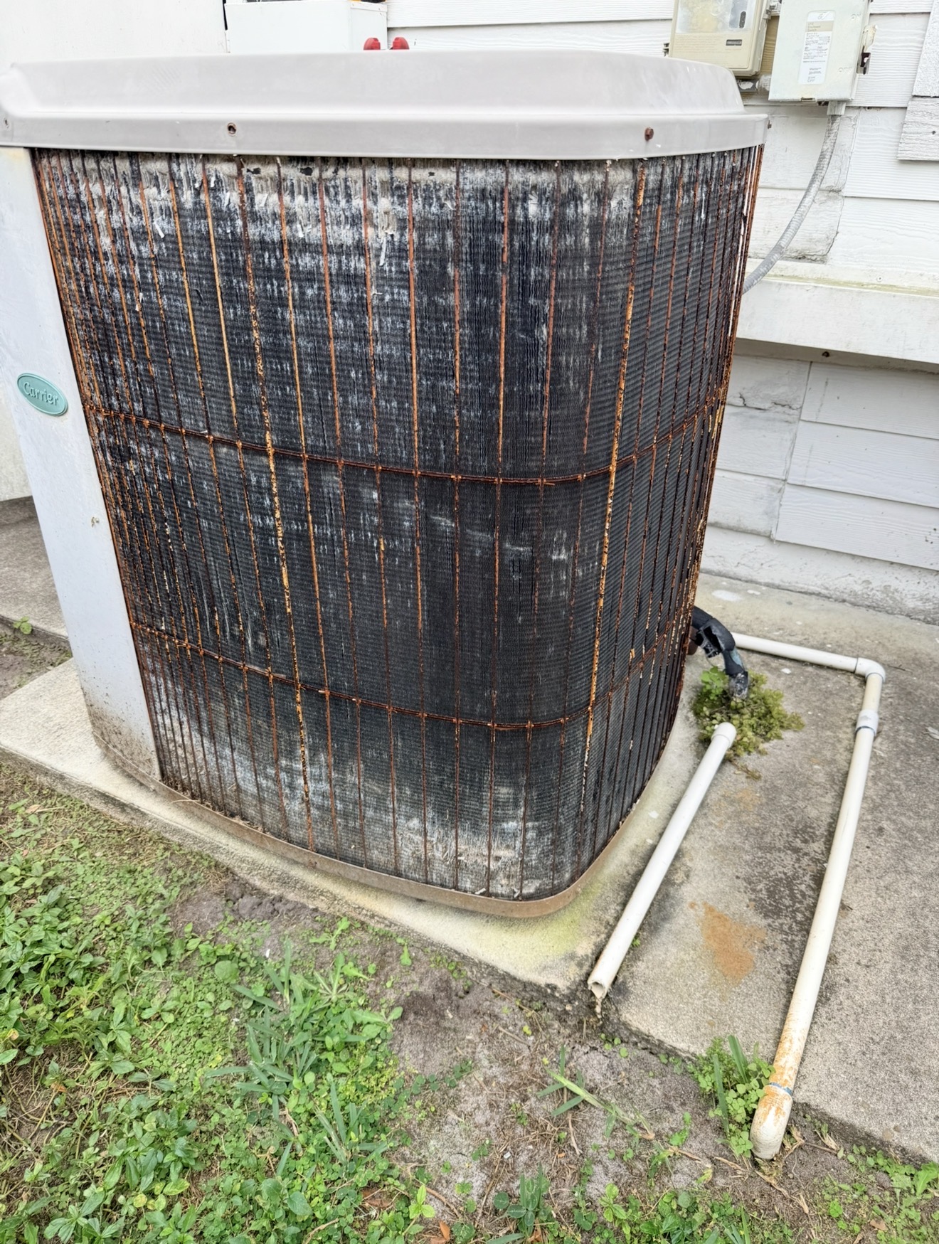 Heavily salt-loaded and fouled condenser coil from a Port St. Lucie air conditioner
