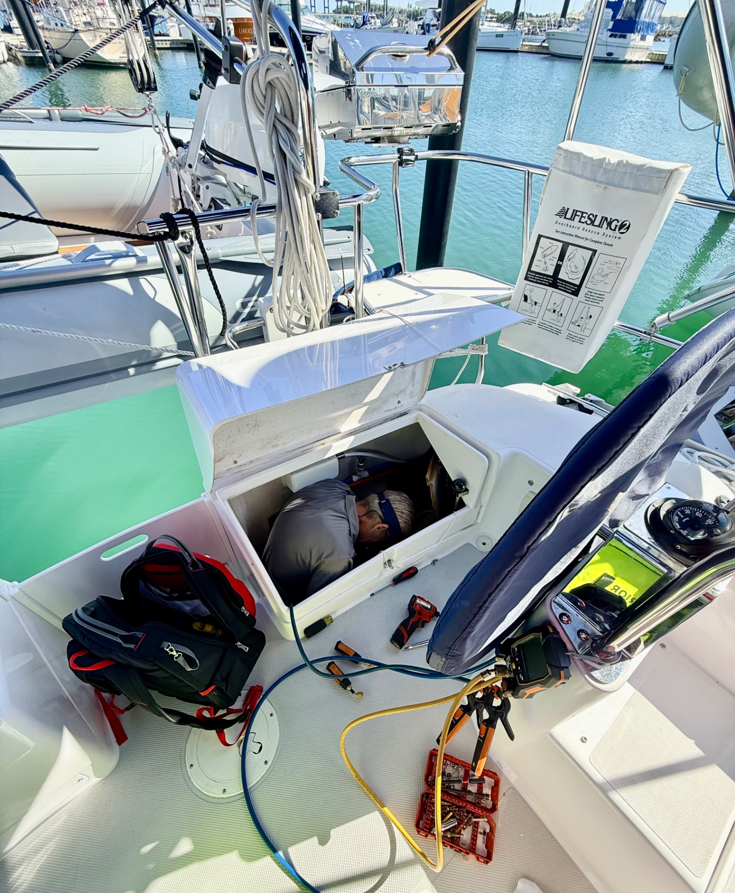 Marine HVAC service inside sailboat helm at Treasure Coast marina